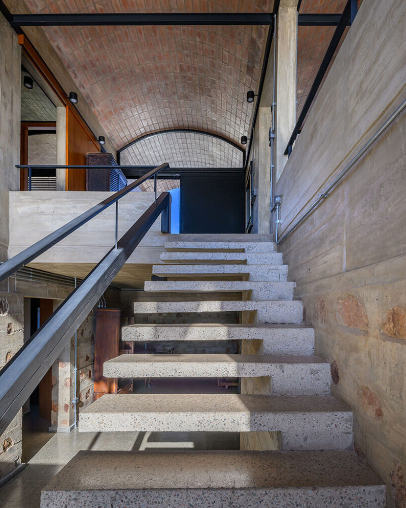 access to the home is through a double-height space that offers views of the golf course