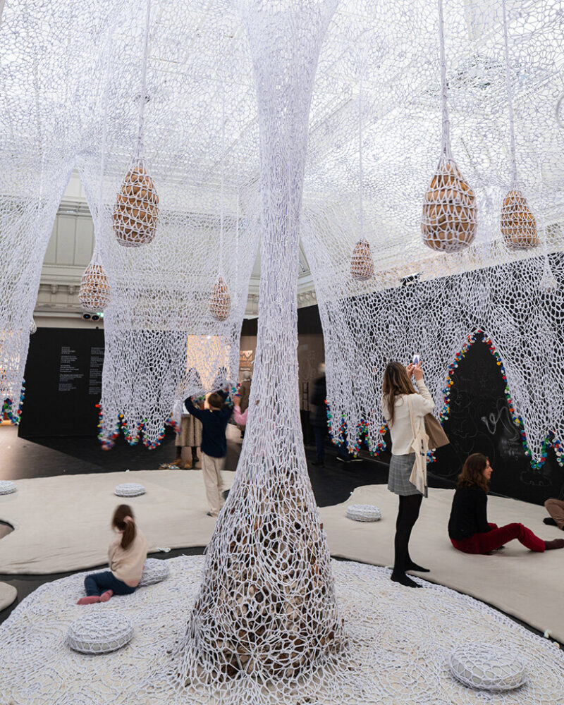 a specially composed song by Neto resonates throughout the space