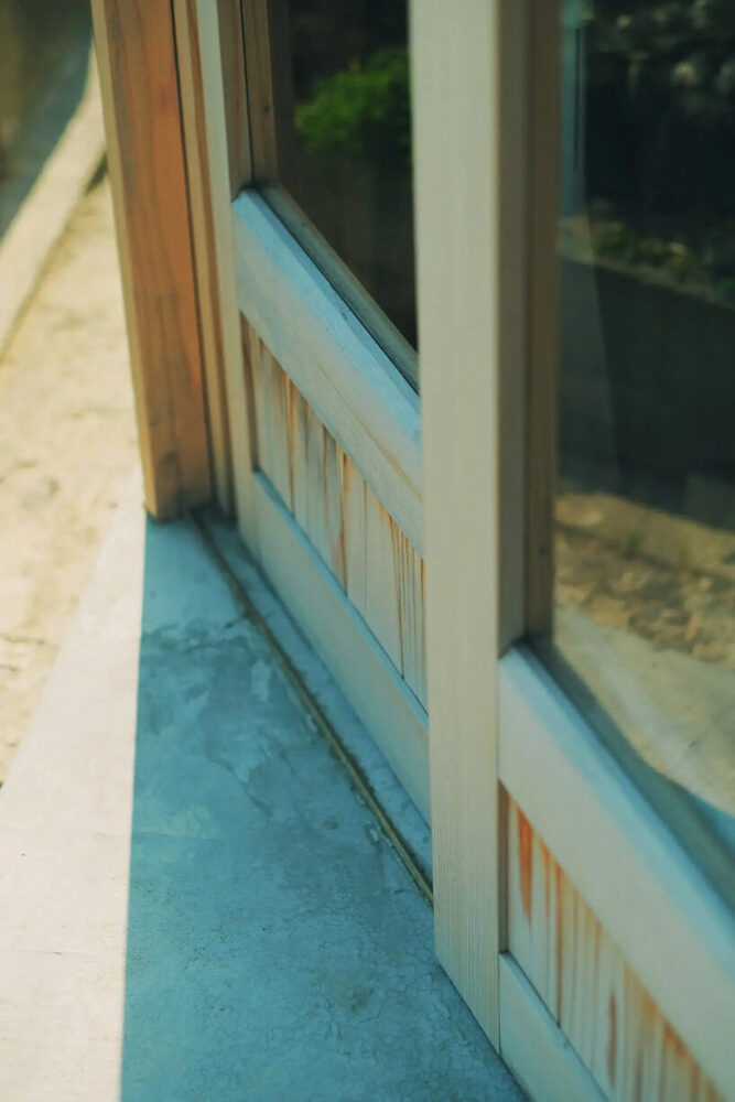 the intricate diagonal axis and rafter details were meticulously chiseled by hand