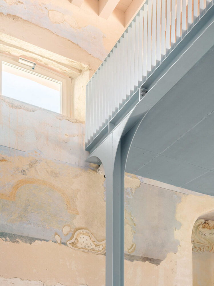 finished in a soft baby blue, the steel frame integrates concealed technical systems