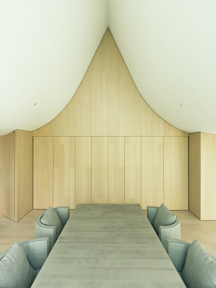 wood clads the walls inside the residence