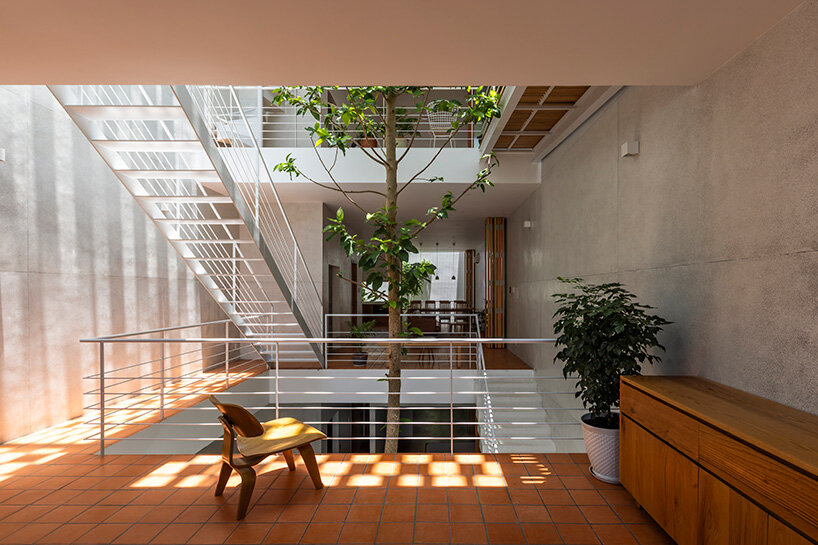 staggered floor slabs from the second floor upwards create layers of open spaces