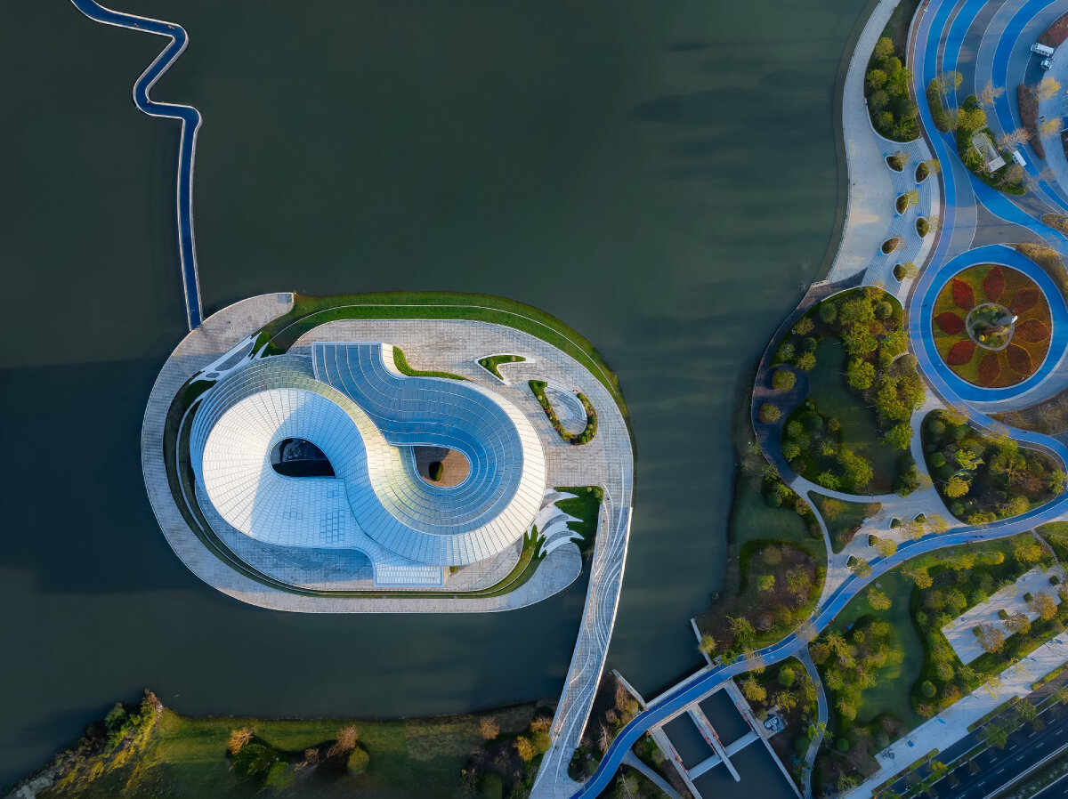 translucent interlocked rings shape aedas' jade-like yohoo museum in china