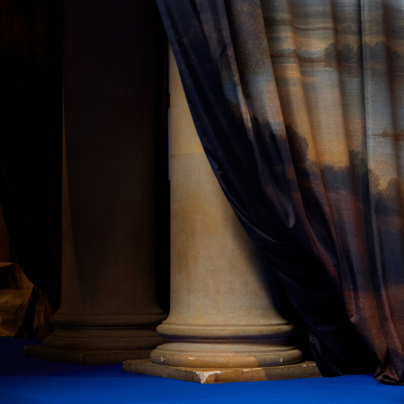 two columns part these somewhat washed-out paintings of the countryside to make way for the models