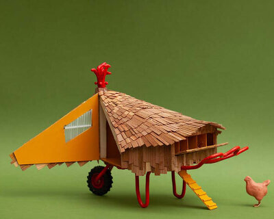 feathered timber shingles wrap hen-shaped chicken coop in UK's lake district