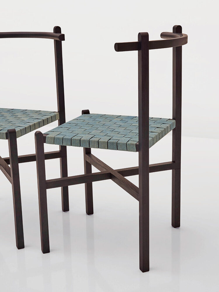 the woven seat is inspired by traditional 'charpai' daybeds