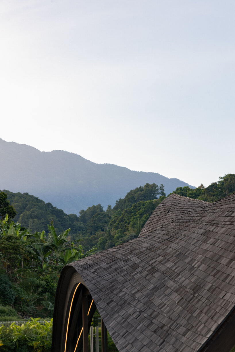 undulating wood and bamboo top k-thengono's wedding compound in indonesia countryside 