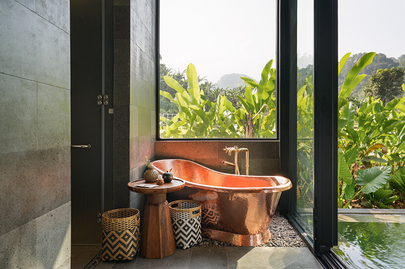 the bathroom of the bridal villa opens to the view yet maintains a sense of intimacy
