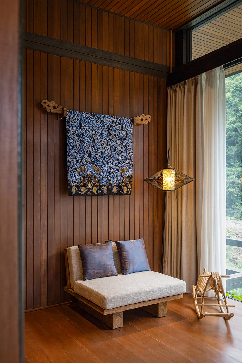 adorned with rich nyatoh wood panels, enhancing both walls and floors