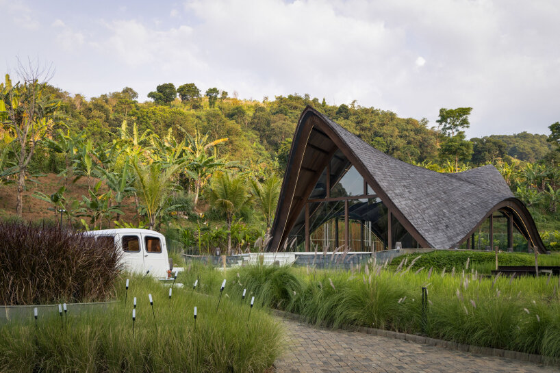 undulating wood and bamboo top k-thengono's wedding compound in indonesia countryside 