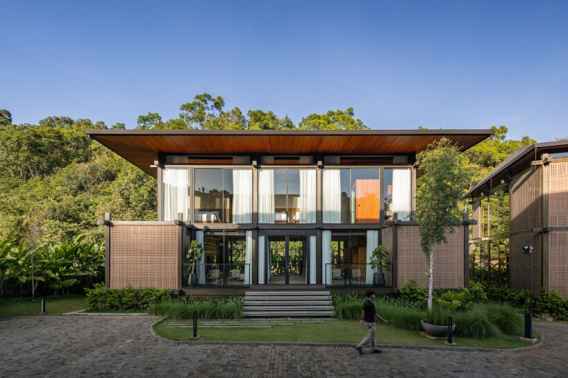undulating wood and bamboo top k-thengono's wedding compound in indonesia countryside 