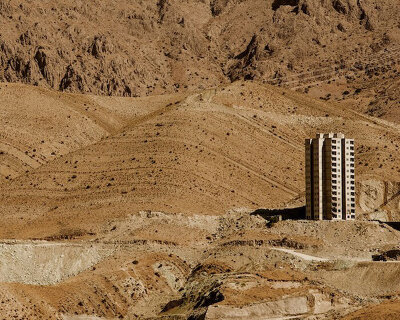 architecture contrasts against arid rock formations in manuel álvarez diestro's photo series