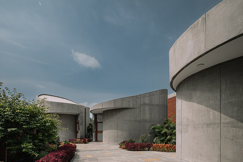 rainwater harvesting and native flora landscaping anchor the project