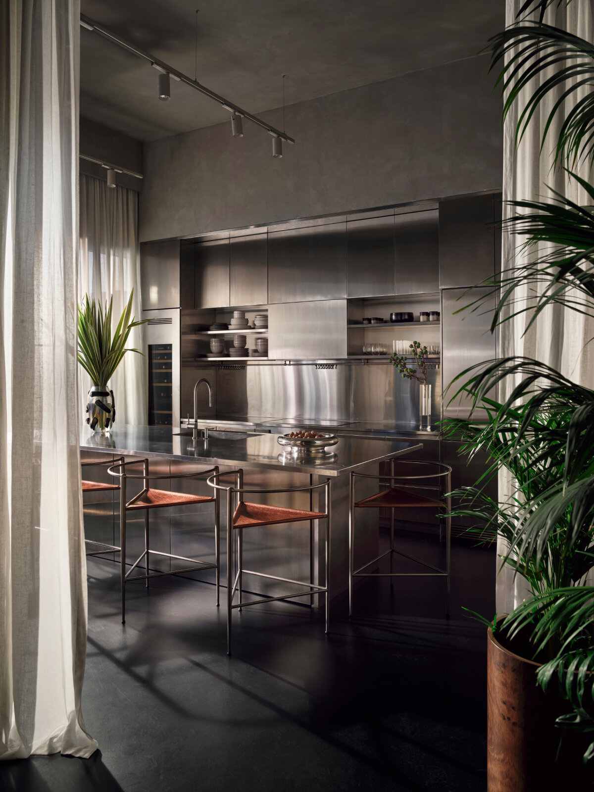 SANAYI313 finishes actress' house in istanbul with industrial accents, organic textures, and sculptural fixtures