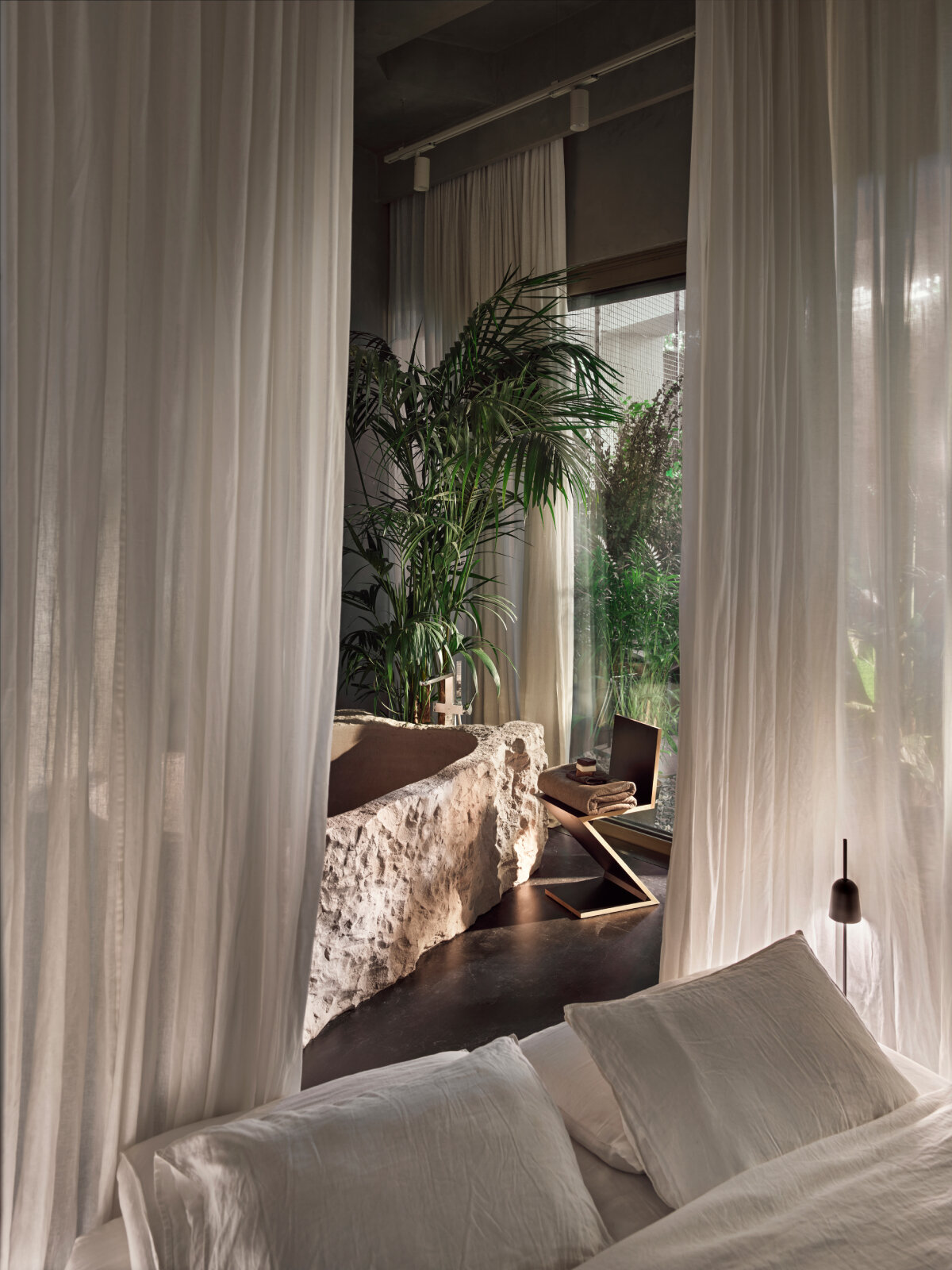 SANAYI313 finishes actress' house in istanbul with industrial accents, organic textures, and sculptural fixtures