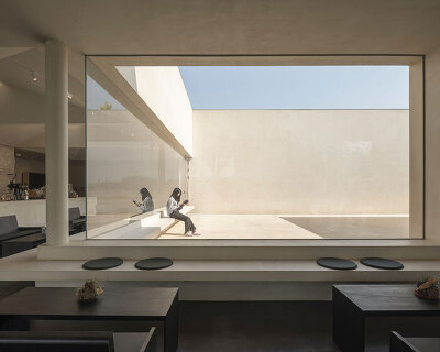 funnel-shaped openings bring light within songmont retail space by archstudio in beijing