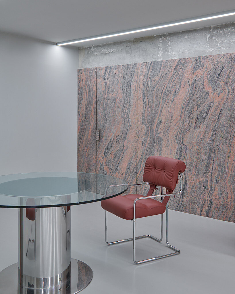 doors are clad with the granite to blend seamlessly with the wall