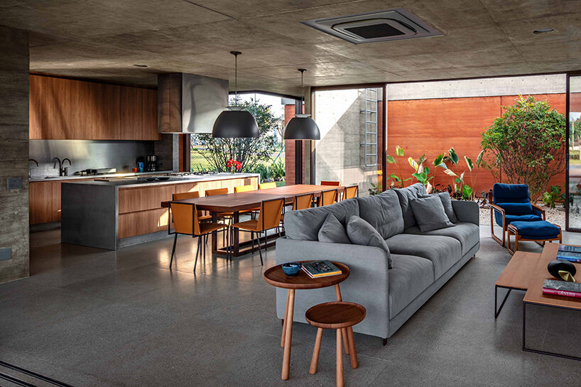 an open space hosts the living room and the kitchen