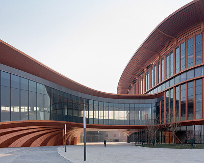 zaha hadid's beijing convention center shaped as series of copper-colored 'ribbons'
