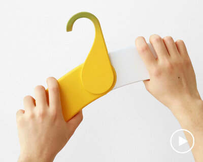 foldable banana-shaped hanger helps children organize their clothes