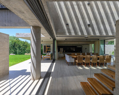 with expressive concrete structure, nnarquitectos' casa nnCLP flooded with striped shadows