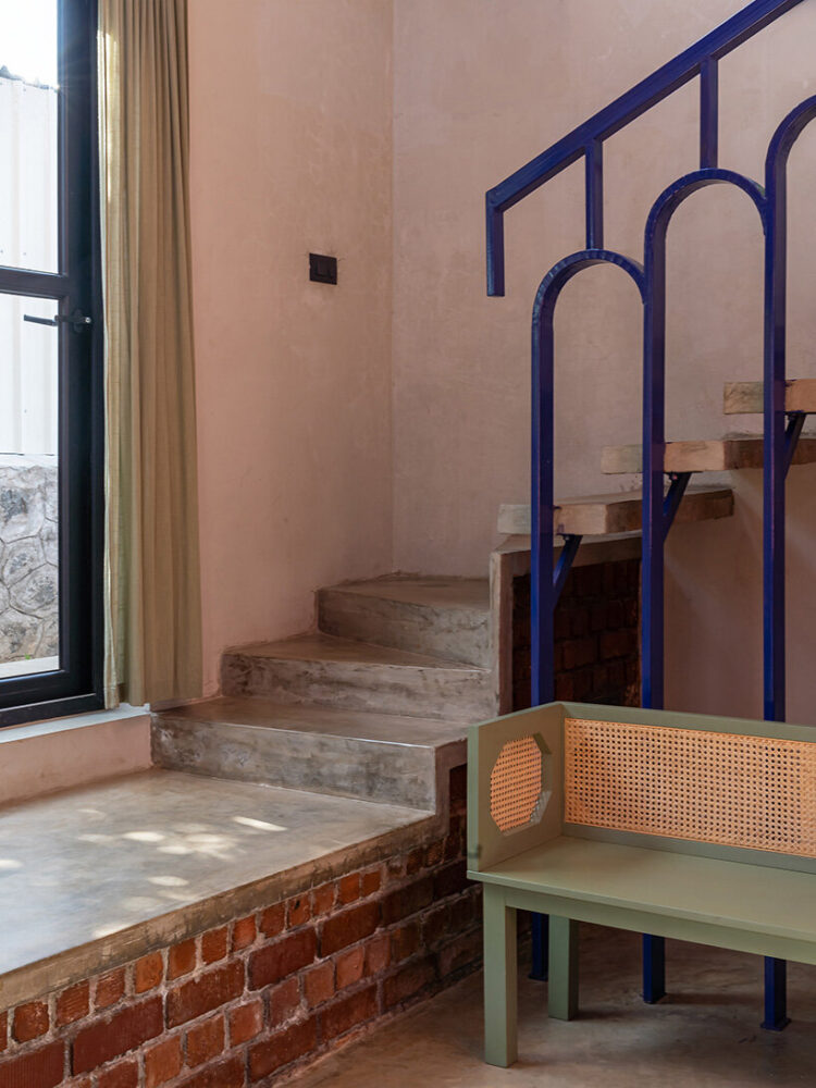 a staircase in the double-height living area leads to the first floor