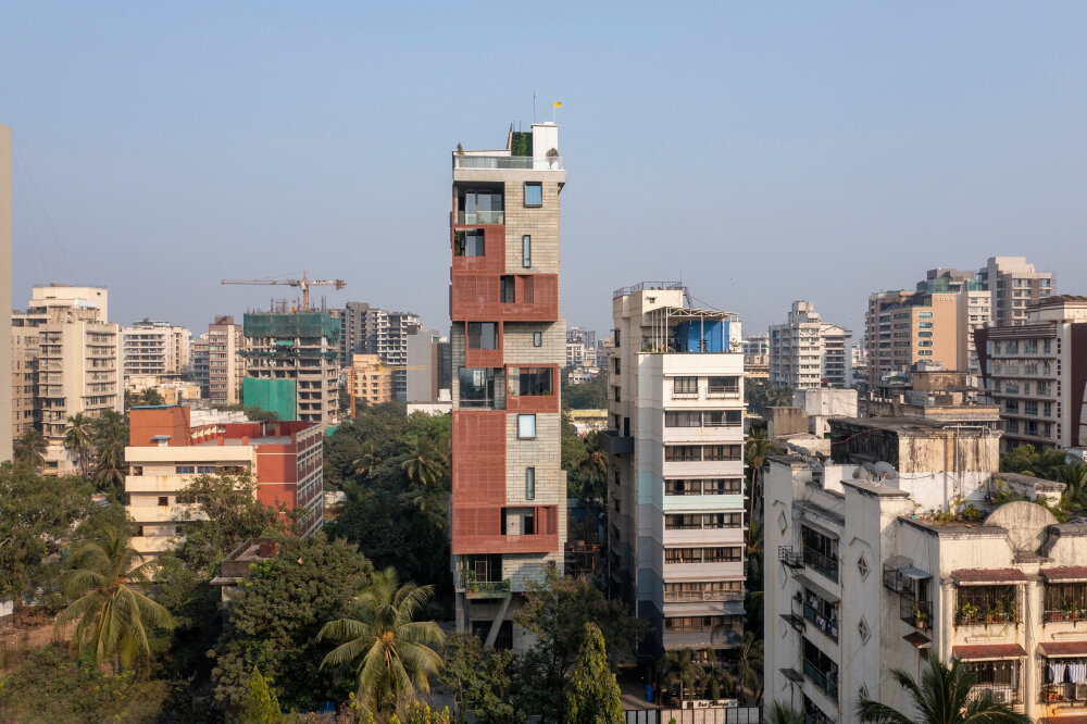 verandahs wrapped in adjustable perforated screens shape malik architecture's residential tower in mumbai