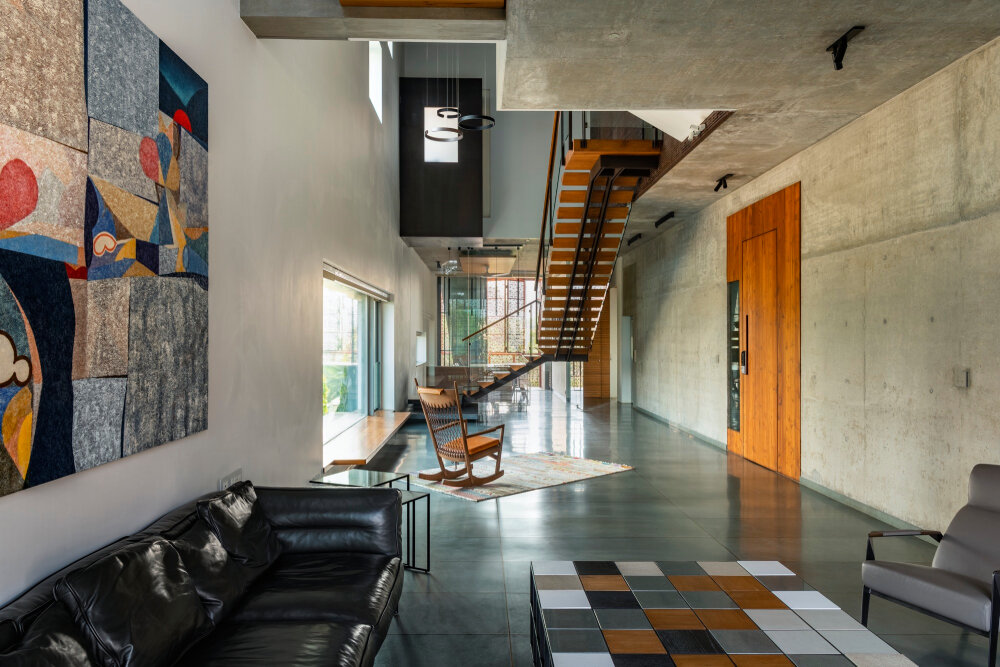 verandahs wrapped in adjustable perforated screens shape malik architecture's residential tower in mumbai