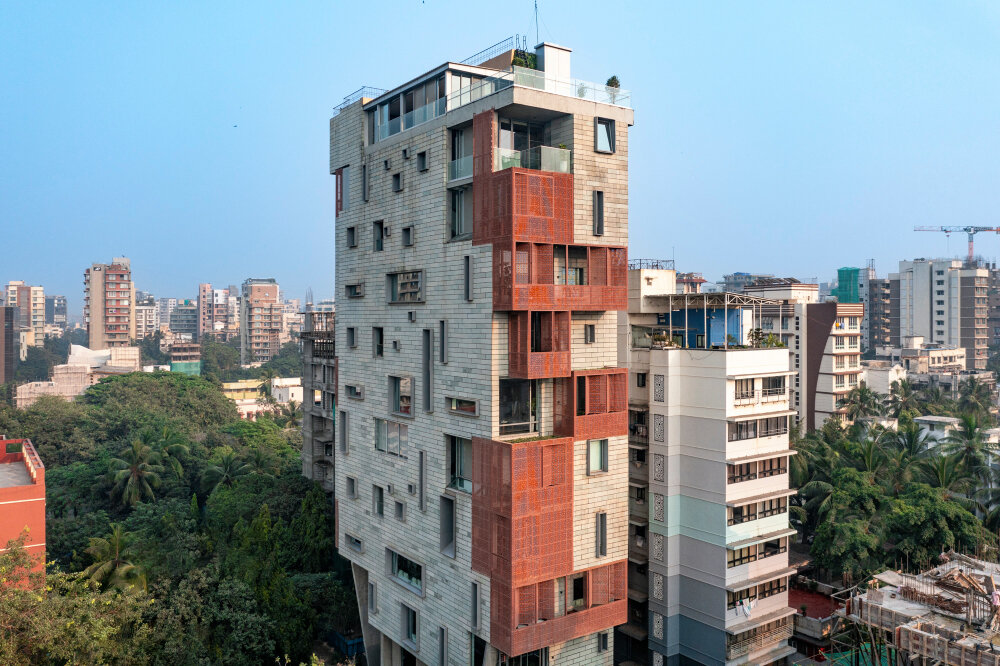 verandahs wrapped in adjustable perforated screens shape malik architecture's residential tower in mumbai
