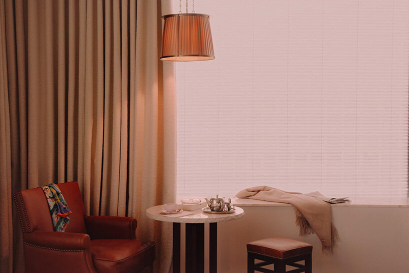 philippe starck places 19th-century house atop monolithic structure for french hotel