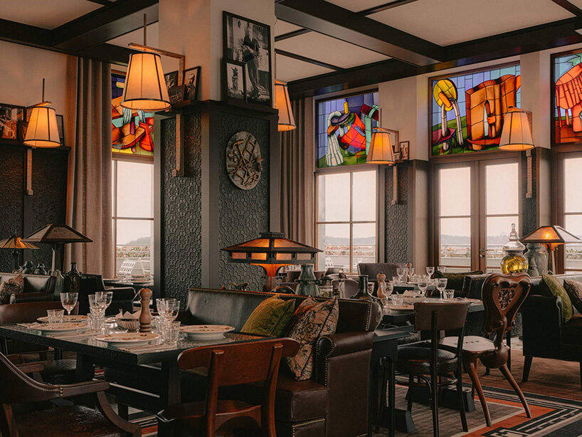 philippe starck places 19th-century house atop monolithic structure for french hotel