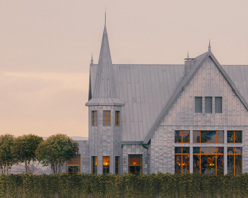 philippe starck places 19th-century house atop monolithic structure for french hotel