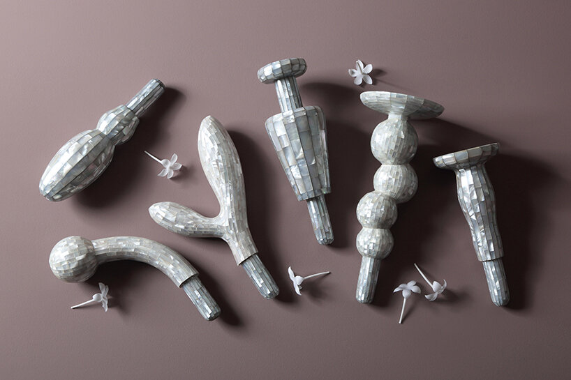 each object conceals a sculpted mother-of-pearl rod