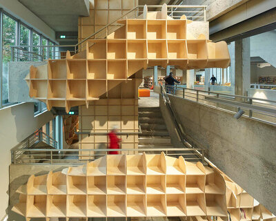 under the canopy: jakob+macfarlane reframes avignon library with undulating shelving