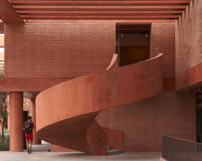 red brick volumes and voids weave sordo madaleno's football campus in mexico 