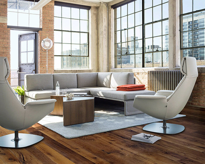 steelcase foresees future of work with cord pass-through & swivel tablet of massaud lounge