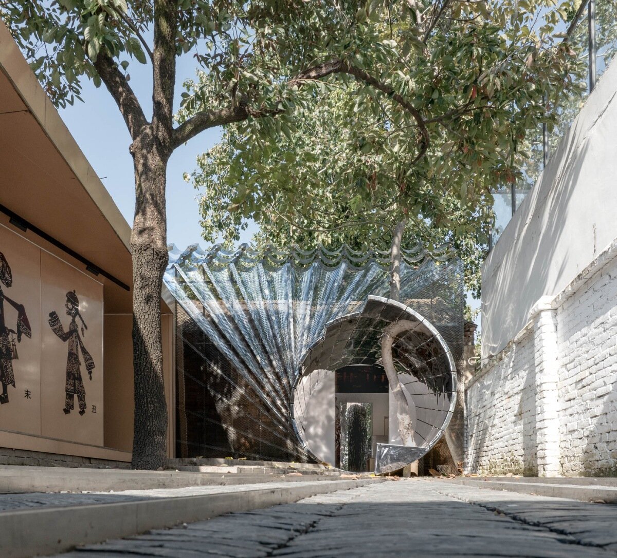 steel mesh curtain veiling daipu architects' china culture hall doubles as rain collecting device