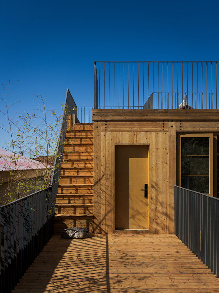 a floating, forest-like dwelling nestled in the rural fabric