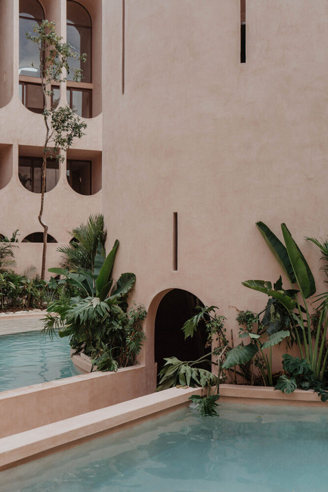 a circular pool at the tower’s base mirrors the form of the central void