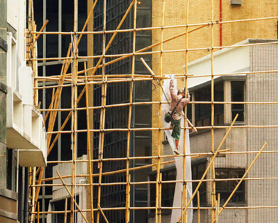 romain jacquet-lagrèze captures bamboo scaffolding workers hovering above hong kong