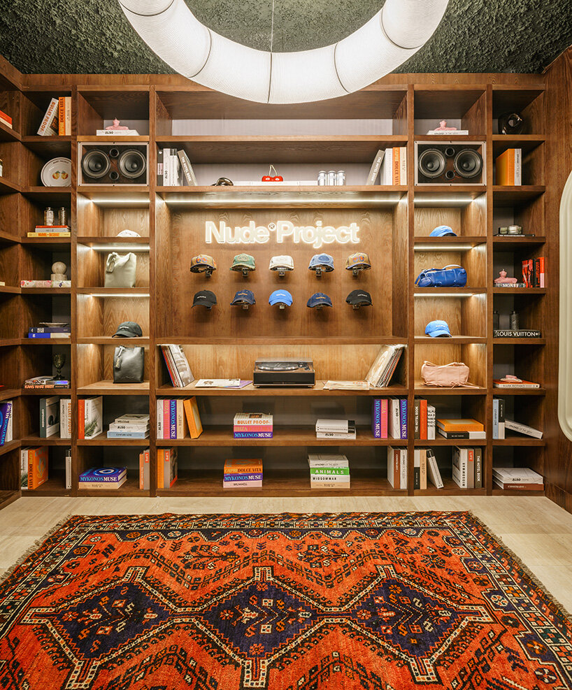 a glowing Tekio lamp by Santa & Cole casts a warm, domestic light