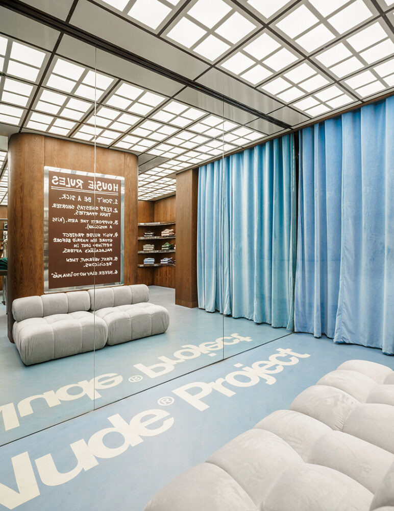 the rules of the Nude House are written on a blackboard