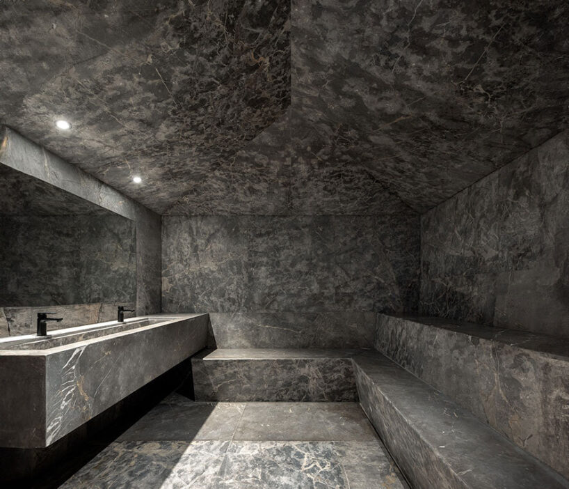 the clubhouse features bathing spaces fully covered in marble stone