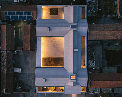 four interwoven gabled wings outline chaoffice's house of cross in beijing