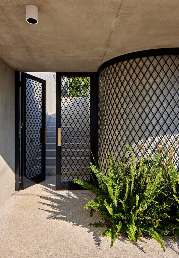 organic curves gently subvert the imposing cubic mass