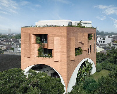 RAD+ar punctures arched facade to protect office building from jakarta's humid climate