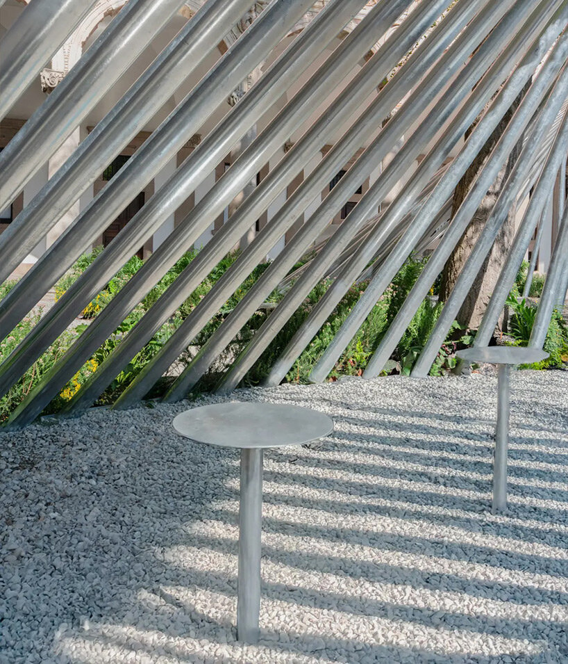 visitors engage with the flow and rhythm of water in a contemplative setting