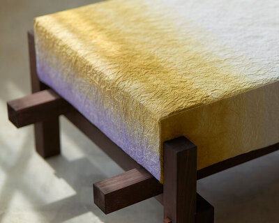 swarm dyes washi paper with hues of purple and gold for installation at milan design week