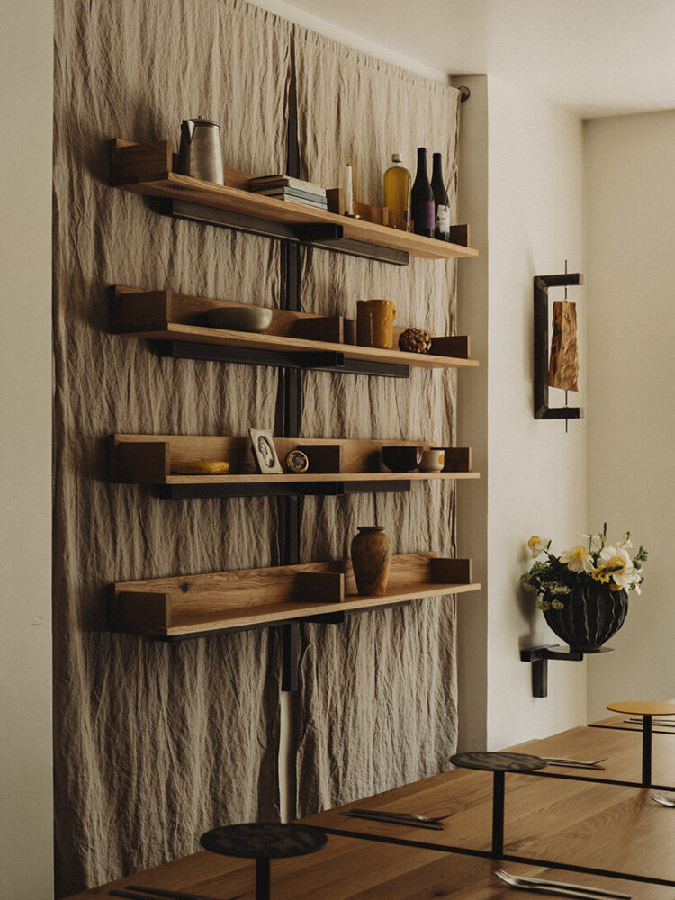 natural oak, stainless steel, and raw linen compose the interior