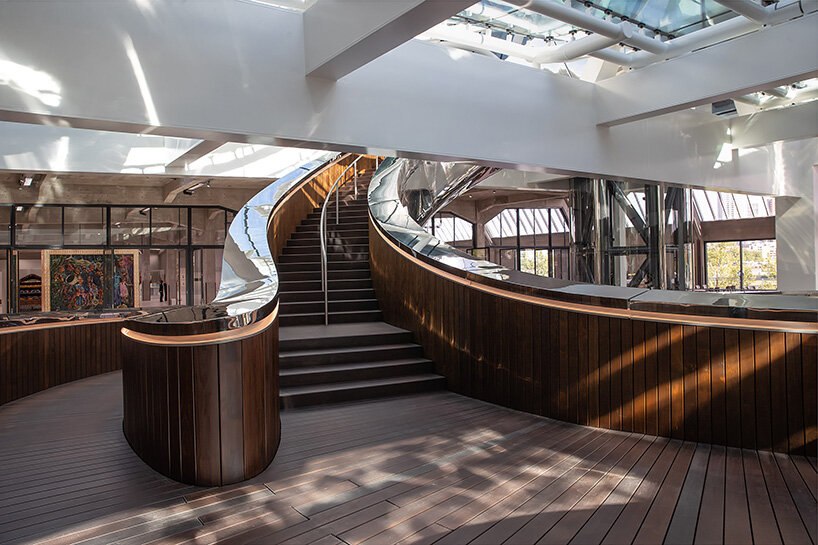 revealing how the staircase captures and transforms natural light